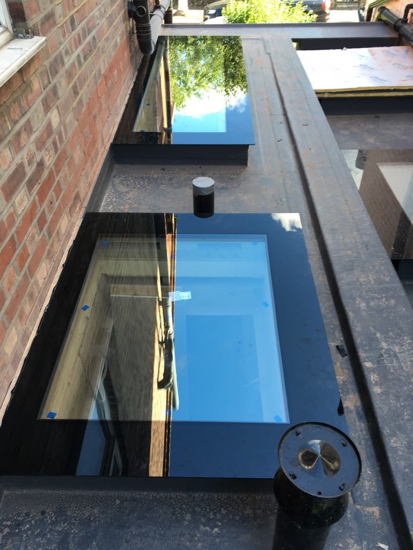 Multiple flat roof skylights on extension in Waltham Abbey